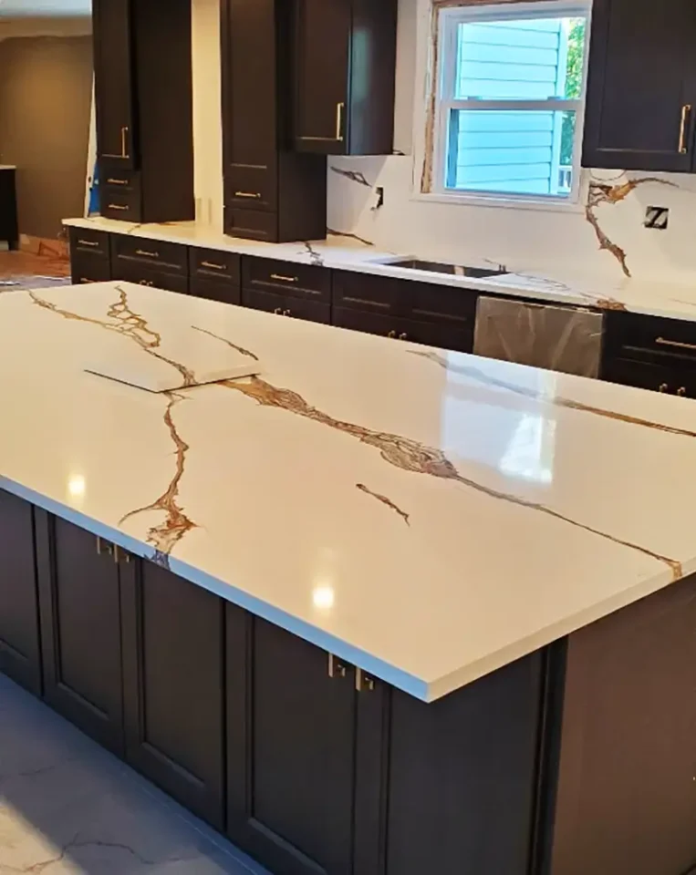 white and brown stone with white cabinets