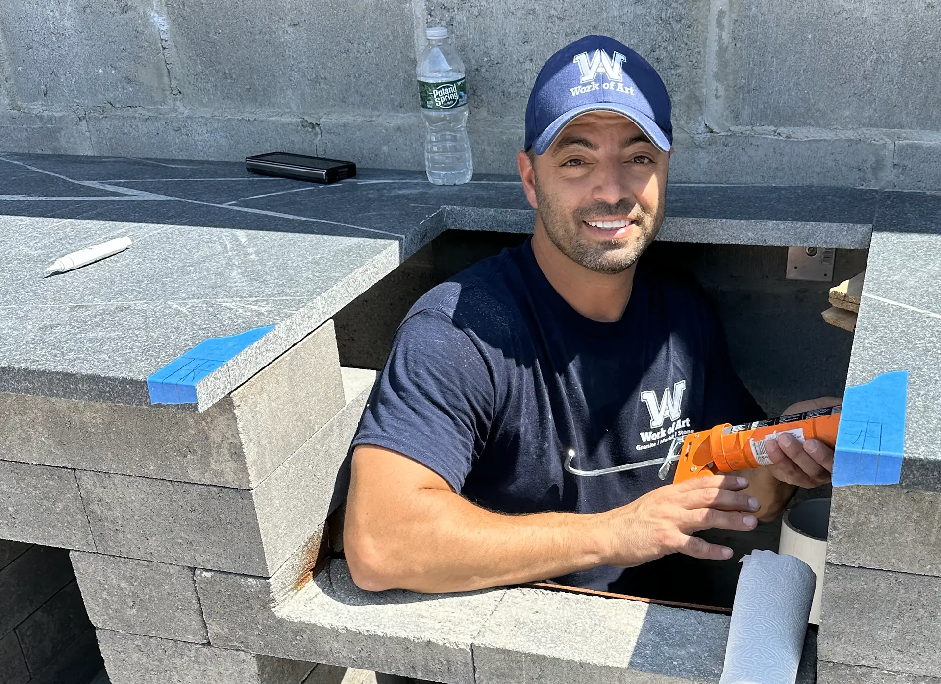work of art granite employee installing outdoor kitchen granite countertop